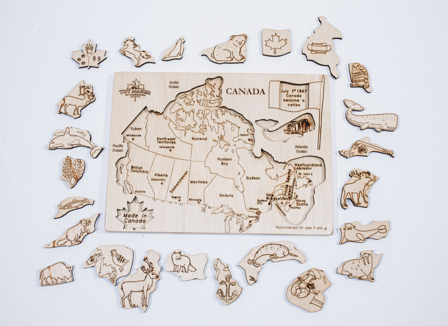 Wooden Canada map inlay puzzle with various native animal shapes scattered around, handmade in Canada.