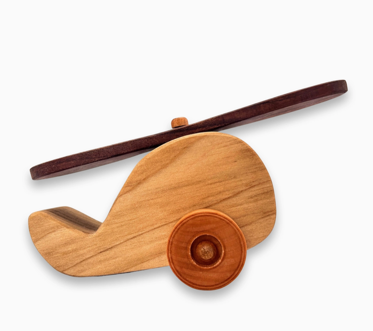 A hand crafted wooden helicopter toy with a spinning rotor, designed for children's imaginative play.